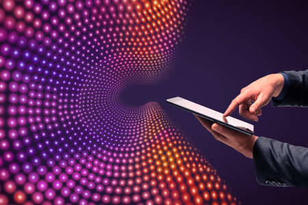 Close up of businessman hand holding and pointing at smartphone on creative big data flow background. Technology, cyberspace, science and digital stream conceptの写真素材