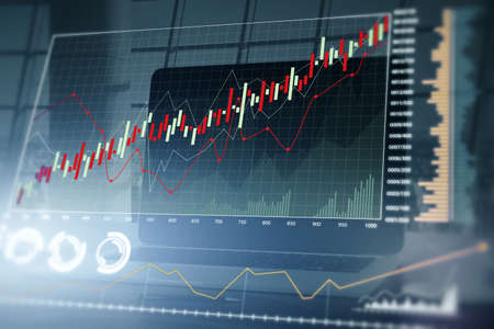 Close up of workspace with laptop computer and creative glowing forex chart on blurry background....