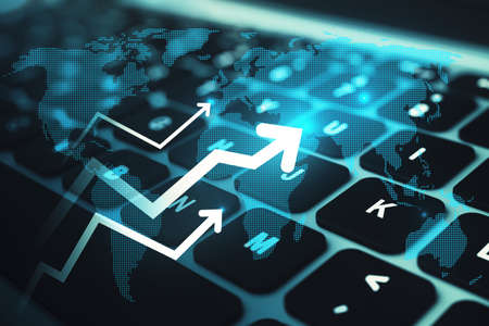 Close up of laptop keyboard with abstract glowing growing business arrow and map hologram on blue background. Technology and internet data concept. double exposureの写真素材