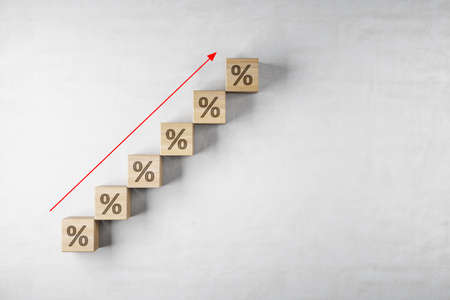 Creative growing interest rate with arrow on concrete background with mock up place. Investment and finance concept. 3D Renderingの写真素材