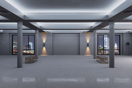 Modern spacious concrete exhibition interior with mock up place on wall, windows and night city...