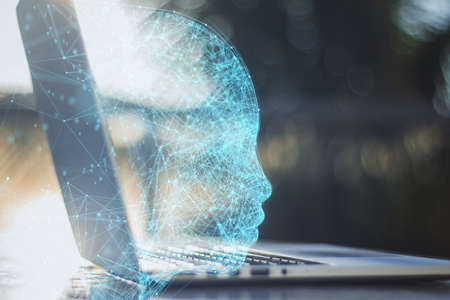 Close up of laptop with abstract polygonal head outline on blurry outdoor background with mock up place. AI and human mind concept. double exposureの写真素材
