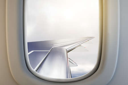 Airplane illuminator wing view on gloomy sky background with mock up place. Trip and flight concept....