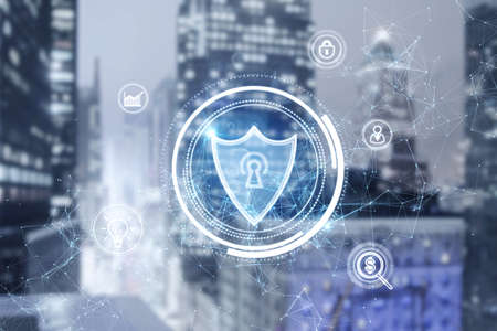 Glowing shield hologram on blurry city background. Antivirus, protection and safety concept. double...