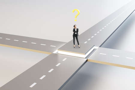 Attractive young european businesswoman standing at crossroads with question. Solution, way and direction conceptの写真素材