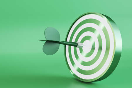 Creative bullseye target with arrow on green background with mock up place. Targeting and marketing...