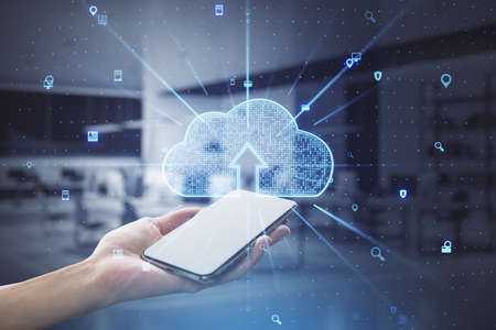 Close up of female hand holding smartphone with abstract glowing cloud hologram on blurry...