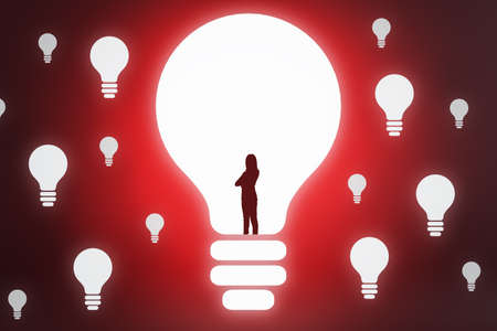 Creative businesswoman outline with light bulb on red background with bright mock up place. Idea and...