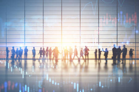 Backlit crowd of businessmen working together in bright office interior with sunlight and glowing...