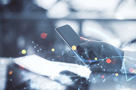 Close up of businessman hand using tablet and smartphone on blurry outdoor background with polygonal bokeh mesh. Push notification, communication and network concept. double exposureの写真素材