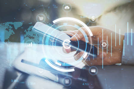 Close up of businessman hands using smartphone with creative glowing round euro chart hologram on...