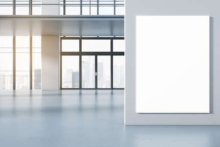 Modern concrete spacious interior with empty mock up poster on wall, glass windows and city view. 3D...