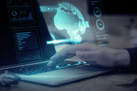 Close up of hand using notebook with creative glowing digital business screen interface, globe and...