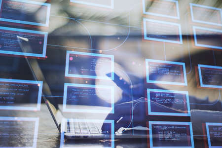 Close up of businessman hands using laptop and smartphone with abstract creative coding programming...