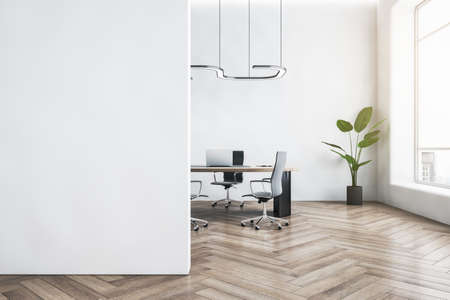 Modern white concrete office interior with empty mock up place on wall, wooden flooring, furniture, window with city view, equipment and decorative plant. 3D Renderingの写真素材