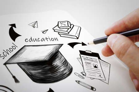 Creative hand drawn education sketch with graduation cap on white backdrop. Knowledge, school and career conceptの写真素材