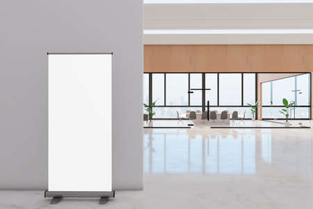 Modern white glass meeting room and corridor interior with empty white roll up poster, furniture,...