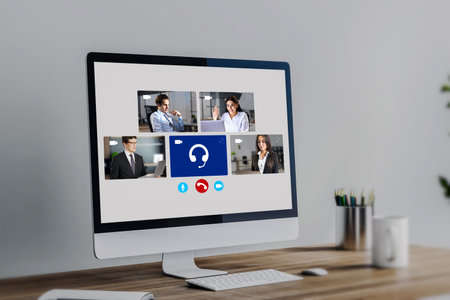 Close up of computer with creative video conference call on screen at workplace. Work, home and remote team conceptの写真素材