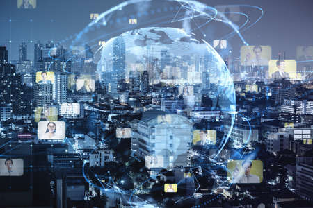 Creative glowing blue globe hologram with faces on blurry night city wallpaper. Hire, alumni, online conference and search concept. double exposureの写真素材