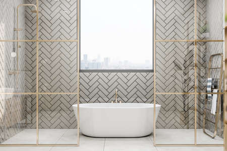 Front view on stylish white bath with golden faucet under the window with city view, golden modern towel rail and glass partitions with gold decorations in sunny bathroom. 3D renderingの写真素材