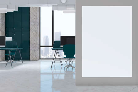 Modern coworking office interior with empty white mock up poster, computer screens on desks, concrete flooring and window with city view. Workplace concept. 3D Renderingの写真素材