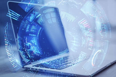 Close up of laptop with creative round digital business chart interface on blurry background. Stock,...