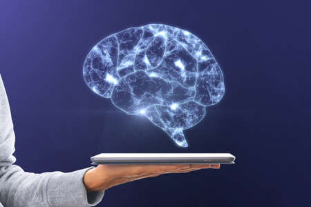 Artificial intelligence and machine learning concept with digital glowing human brain symbol above...
