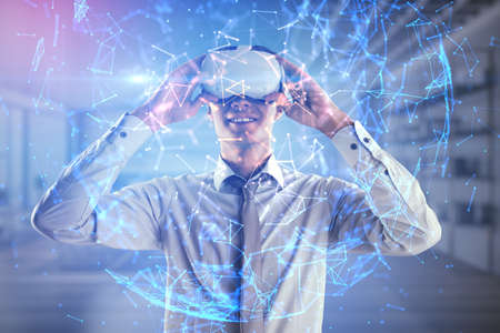 Virtual office and VR networking concept with young man in modern headset and digital glowing sphere...