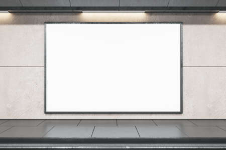 Front view on blank white banner with place for your logo or text in empty subway area with gray...