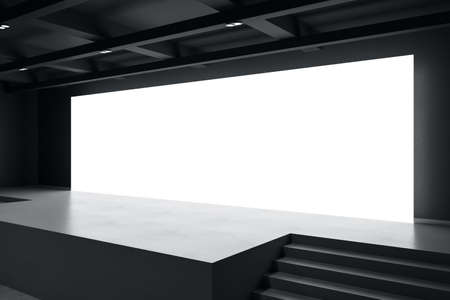 Perspective view on big blank white illuminated screen with place for your text or logo in empty...