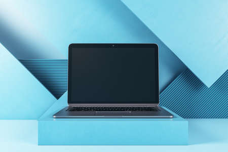 Close up of empty laptop screen on blue geometric wall background. Tech presentation and device concept. Mockup, 3D Renderingの写真素材