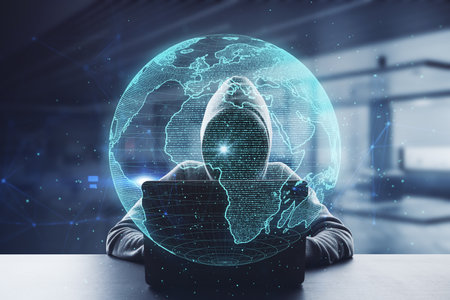 Hacker at desktop using laptop with creative glowing polygonal grid planet on blurry office interior...
