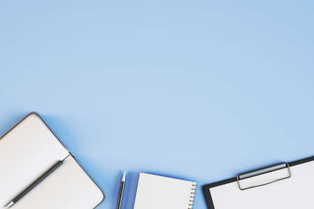 Top view of empty blue desktop with supplies. Work place and stationery objects concept. Mockup, 3D...