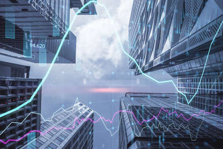 Bottom view of abstract city backdrop with glowing forex chart. Trade, finance, technology and...