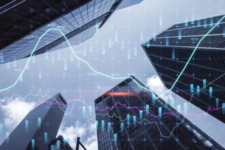 Bottom view of creative city background with glowing forex chart. Trade, finance, technology and...