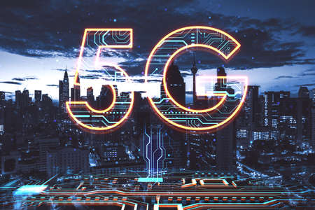 Abstract 5G hologram on blurry night city background. Speed, internet and technology, communication concept. double exposureの写真素材