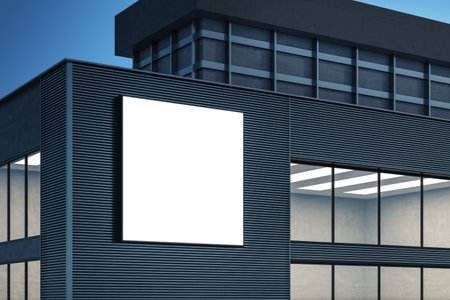 Modern building exterior with empty white mock up banner billboard on night sky background. Ad and commercial concept. 3D Renderingの写真素材