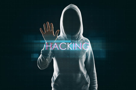 Hacker using abstract creative digital text hologram on dark background. Hacking, technology and ai conceptの写真素材