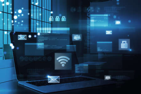 Close up of office workplace with laptop and abstract glowing digital transformation hologram on blurry background. double exposureの写真素材