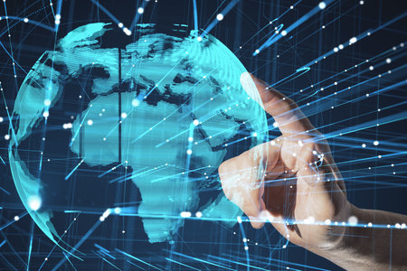 Close up of businessman poiabnting at abstract glowing globe hologram with lines on blue background....