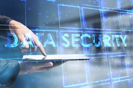 Close up of businessman hand pointing at smartphone with creative blue cubes data security text hologram on blurry background. Technology, secure and information protection concept. double exposureの写真素材