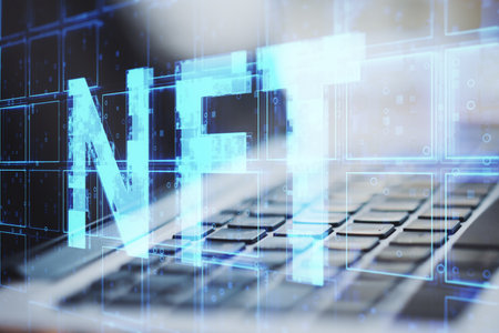 Close up of laptop keyboard with creative blue cubes NFT text hologram on blurry background. Technology, cryptocurrency, nonfungible token and information concept. double exposureの写真素材