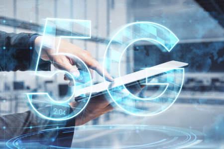 Close up of businessman hand pointing at cellphone with abstract glowing 5G hologram on blurry office interior background. Mobile internet speed, communication and technology concept. double exposureの写真素材
