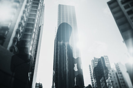 Creative city with business people silhouettes and bright white sky light. backdrop image. Teamwork, success and meeting concept. double exposureの写真素材