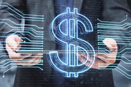 Close up of businessman hand holding digital pad with glowing dollar hologram on blurry office...
