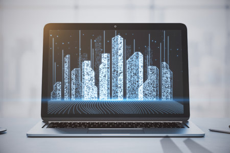 Close up of laptop screen with abstract creative pixel city hologram. Smart city, innovative...