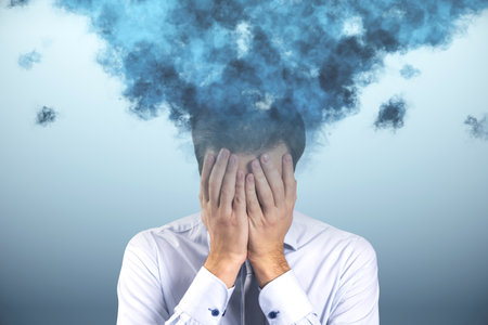Head in the clouds concept. Cloud head attractive european businessman stressing or worrying on light backgroundの写真素材