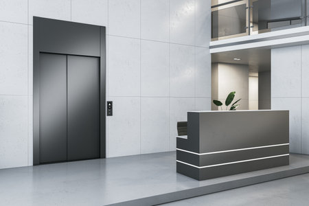 Clean office lobby interior with elevator and reception desk, docorative plant and concrete...