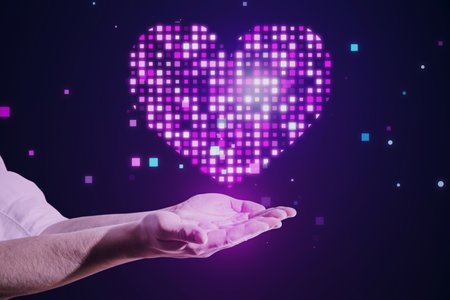 Close up of male hand holding abstract glowing purple pixel heart on blurry background. Health, cardiology and game interface conceptの写真素材
