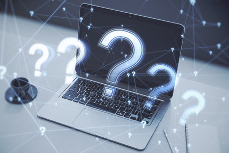 Support and education concept with light digital question marks on modern laptop on office table...